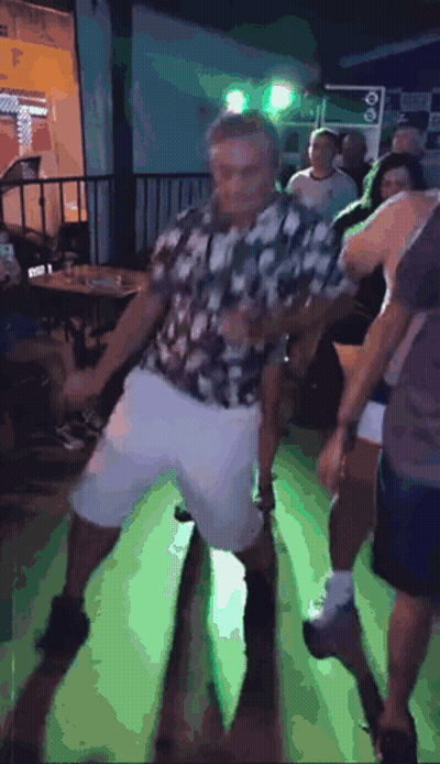 Man In Plaid Shirt Dancing On Green Floor GIF