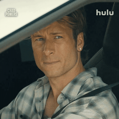 Man In Plaid Shirt Driving Car With Hulu Logo GIF
