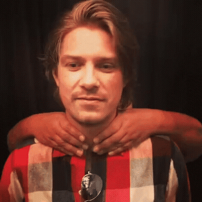Man In Plaid Shirt Getting Neck Massage GIF
