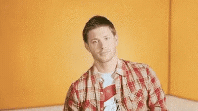 Man in Plaid Shirt Giving Thumbs Up