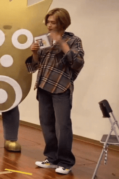 Man In Plaid Shirt Holding Card GIF