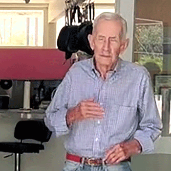 Man In Plaid Shirt Holding Glass GIF