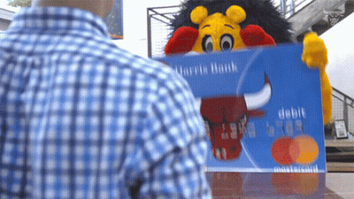 Man In Plaid Shirt Holding Harris Bank Credit Card GIF