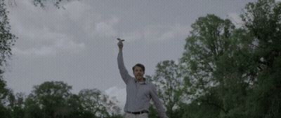 Man In Plaid Shirt Holding Lightning Bolt GIF