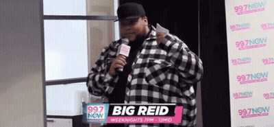 Man In Plaid Shirt Holding Microphone GIF