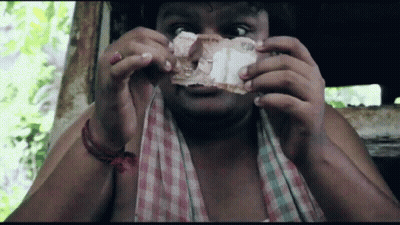 Man In Plaid Shirt Holding Paper GIF