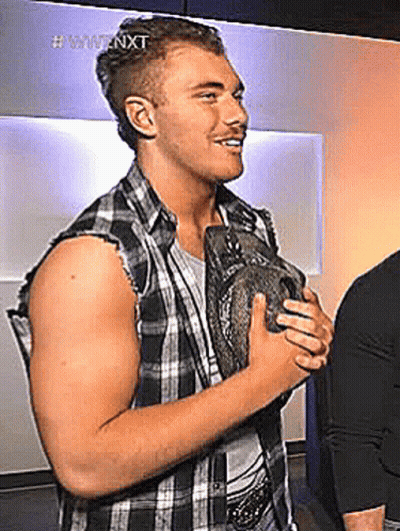Man In Plaid Shirt Holding Trophy Smiling GIF