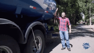 Man In Plaid Shirt In Front Of Blue Truck Manual Do Mundo GIF