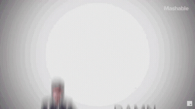 Man In Plaid Shirt In Front Of Mashable Ad GIF