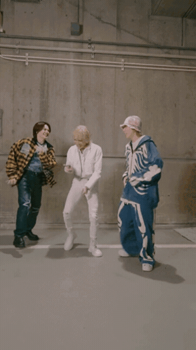 Man In Plaid Shirt Kicking Another Man GIF