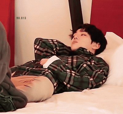 Man In Plaid Shirt Laying On Bed No 813 GIF