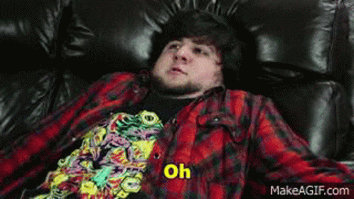 Man In Plaid Shirt Laying On Couch Says My Favourite GIF