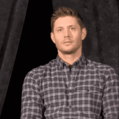 Man In Plaid Shirt Looking At Camera GIF