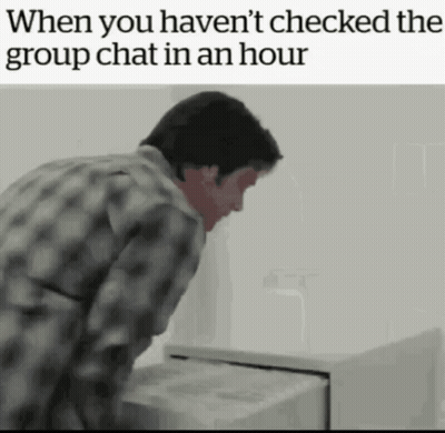 Man In Plaid Shirt Looking Into Filing Cabinet When You Haven't Checked The Group Chat GIF