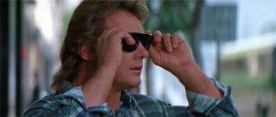 Man In Plaid Shirt Looking Through Sunglasses GIF