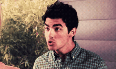 Man In Plaid Shirt Making A Face GIF