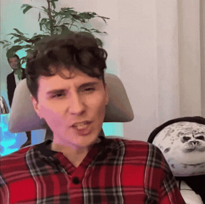 Man In Plaid Shirt Making A Face GIF