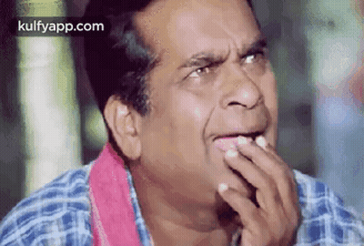 Man In Plaid Shirt Making Funny Face Hand On Mouth GIF