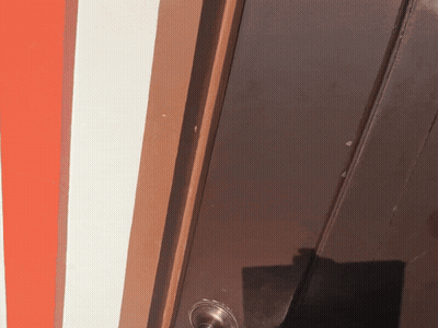 Man In Plaid Shirt Making OK Sign In Doorway GIF