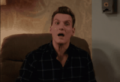 Man In Plaid Shirt Making Surprised Face GIF
