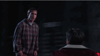Man In Plaid Shirt Next To Man In Red Jacket GIF
