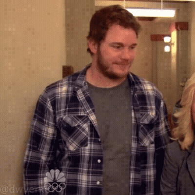 Man In Plaid Shirt Next To Woman GIF