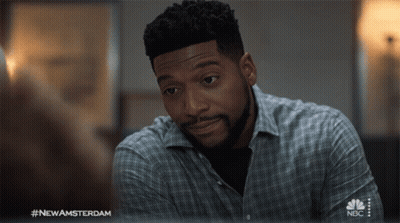 Man In Plaid Shirt On NBC Television GIF