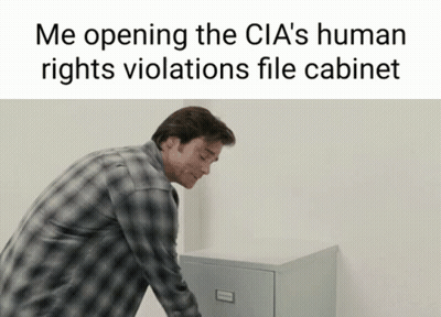 Man In Plaid Shirt Opening File Cabinet GIF