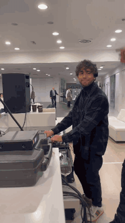 Man In Plaid Shirt Playing Mixer GIF