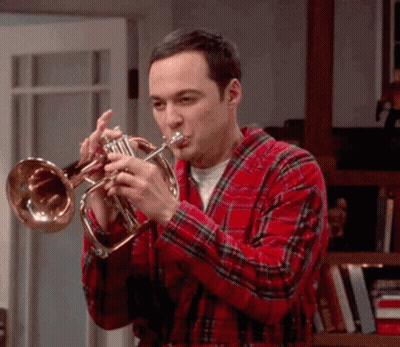 Man In Plaid Shirt Playing Trumpet GIF