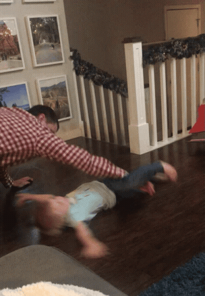 Man In Plaid Shirt Playing With Child GIF