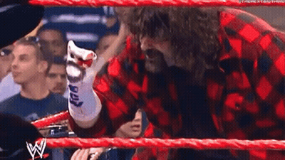 Man In Plaid Shirt Pointing In Wrestling Ring GIF