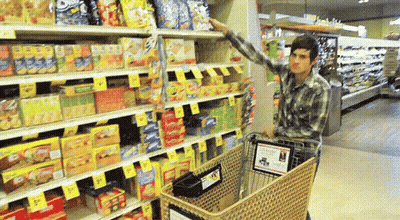 Man In Plaid Shirt Pushing Shopping Cart GIF
