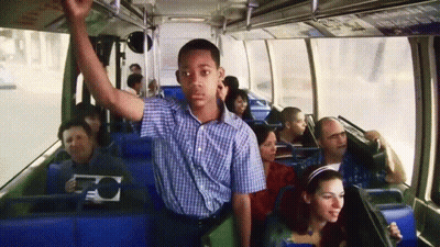 Man In Plaid Shirt Riding Bus GIF