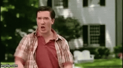 Man In Plaid Shirt Running In Front Of House GIF