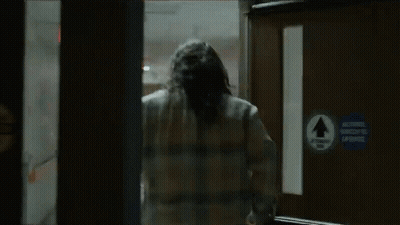 Man In Plaid Shirt Running Through Doorway GIF