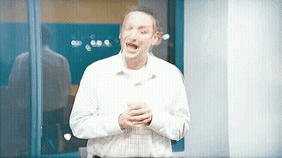 Man In Plaid Shirt Screaming In Front Of Window GIF