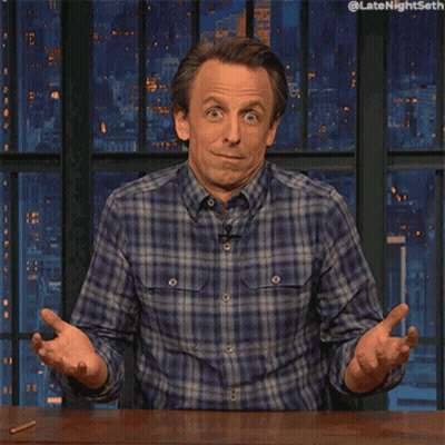 Man In Plaid Shirt Sitting At Table GIF