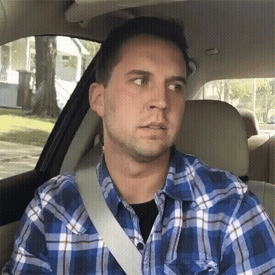 Man In Plaid Shirt Sitting In Car With Seat Belt GIF