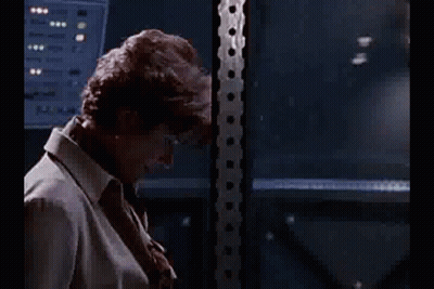 Man In Plaid Shirt Sitting In Green Lab Chair GIF