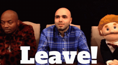 Man In Plaid Shirt Sitting Next To Puppet GIF