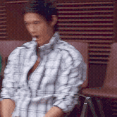 Man In Plaid Shirt Sitting On Chair GIF