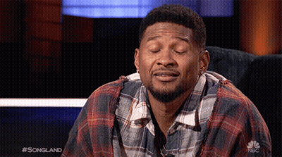 Man In Plaid Shirt Sitting On Couch Eyes Closed GIF
