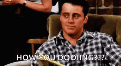 Man In Plaid Shirt Sitting On Couch GIF