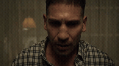 Man In Plaid Shirt Sitting GIF