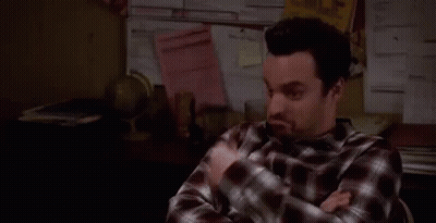Man In Plaid Shirt Sitting With Crossed Arms GIF