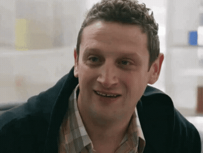 Man In Plaid Shirt Smiling At Camera GIF
