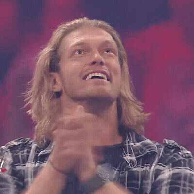 Man In Plaid Shirt Smiling With Arms In Air GIF
