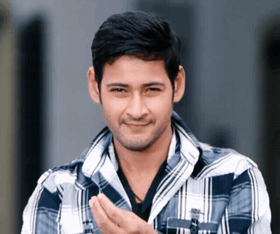 Man In Plaid Shirt Smiling With Hands Folded GIF
