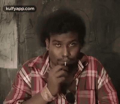 Man In Plaid Shirt Smoking Cigarette GIF